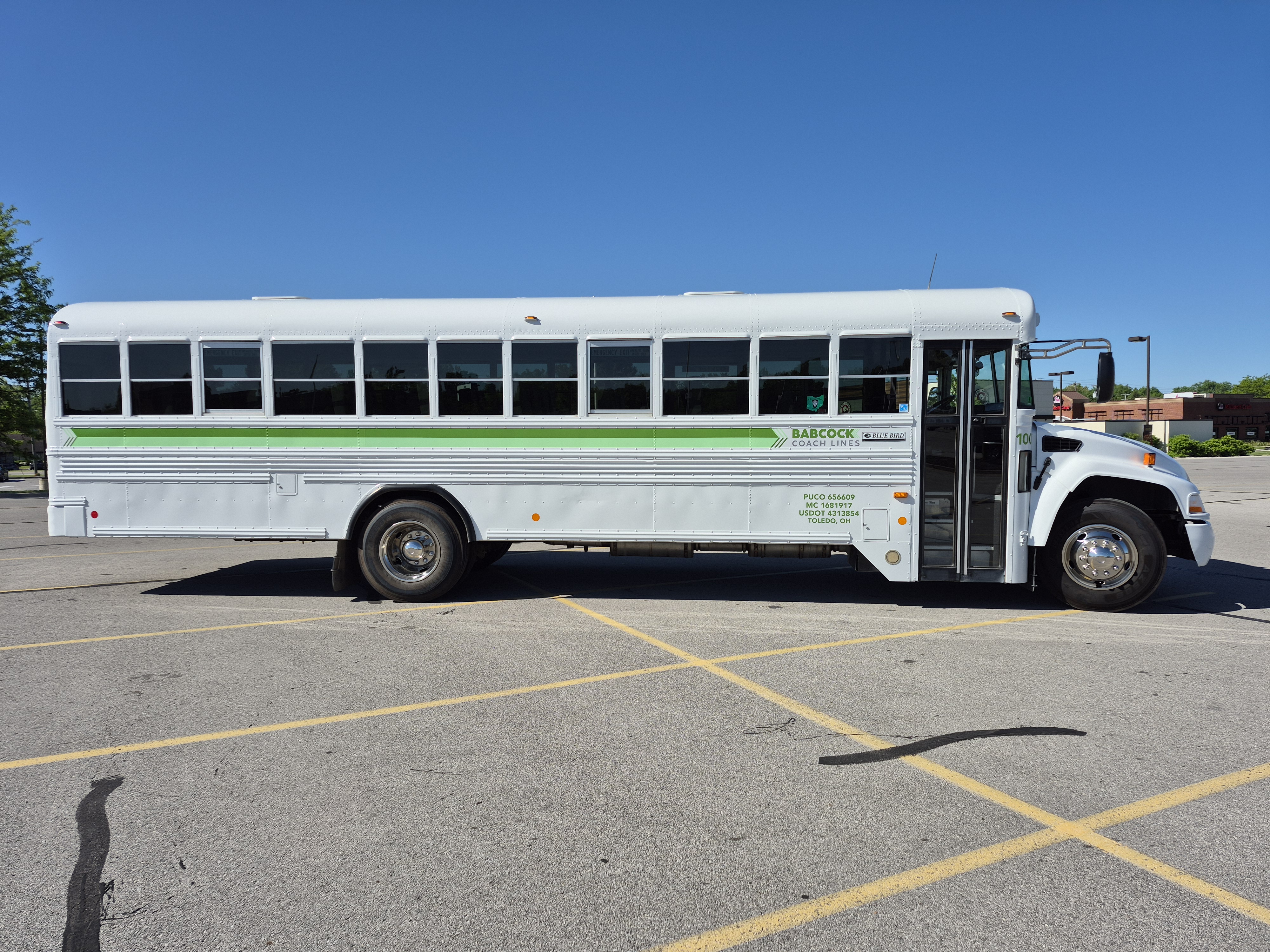 Side view of Babcock Coach Lines bus